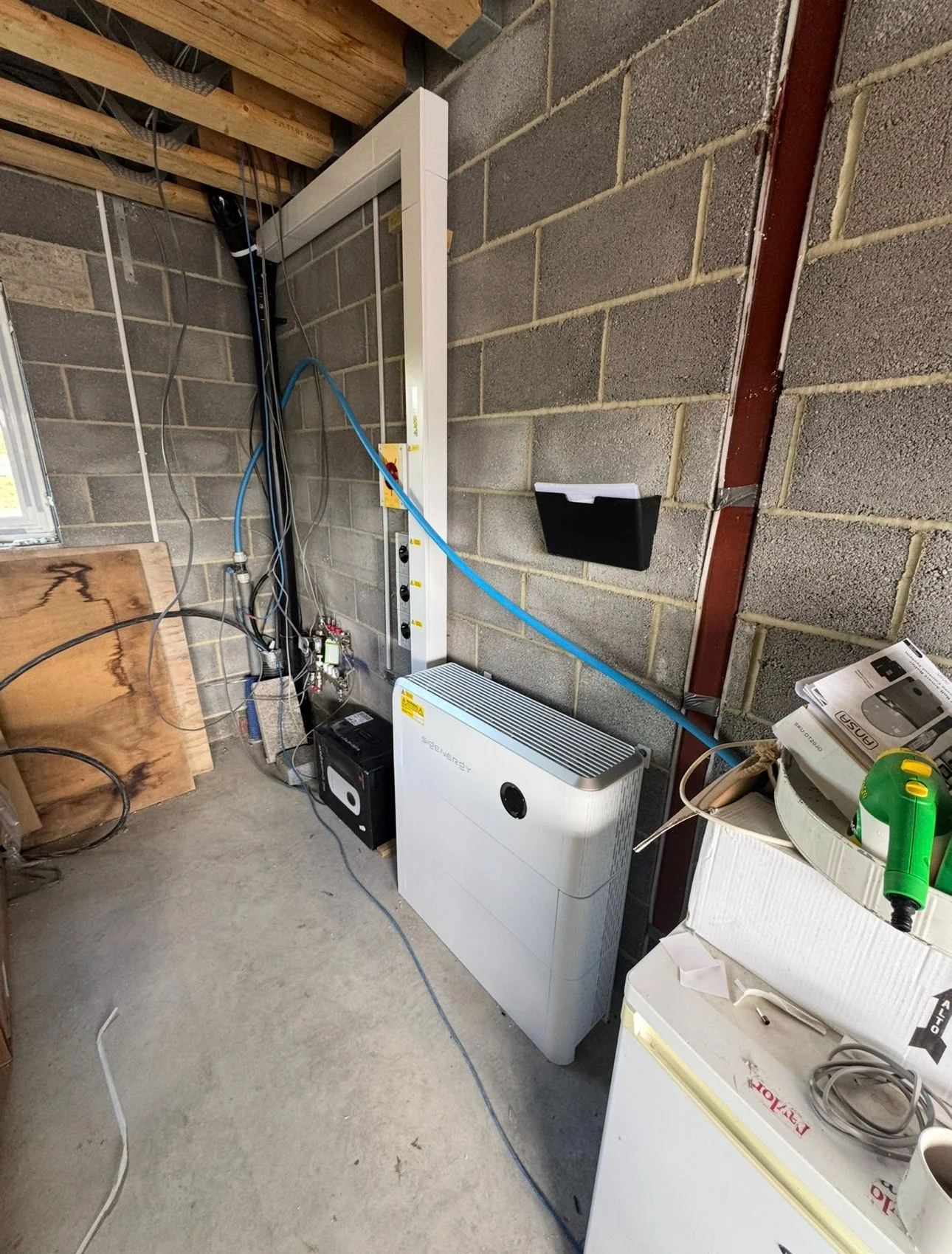Home battery and isolators installed in a garage