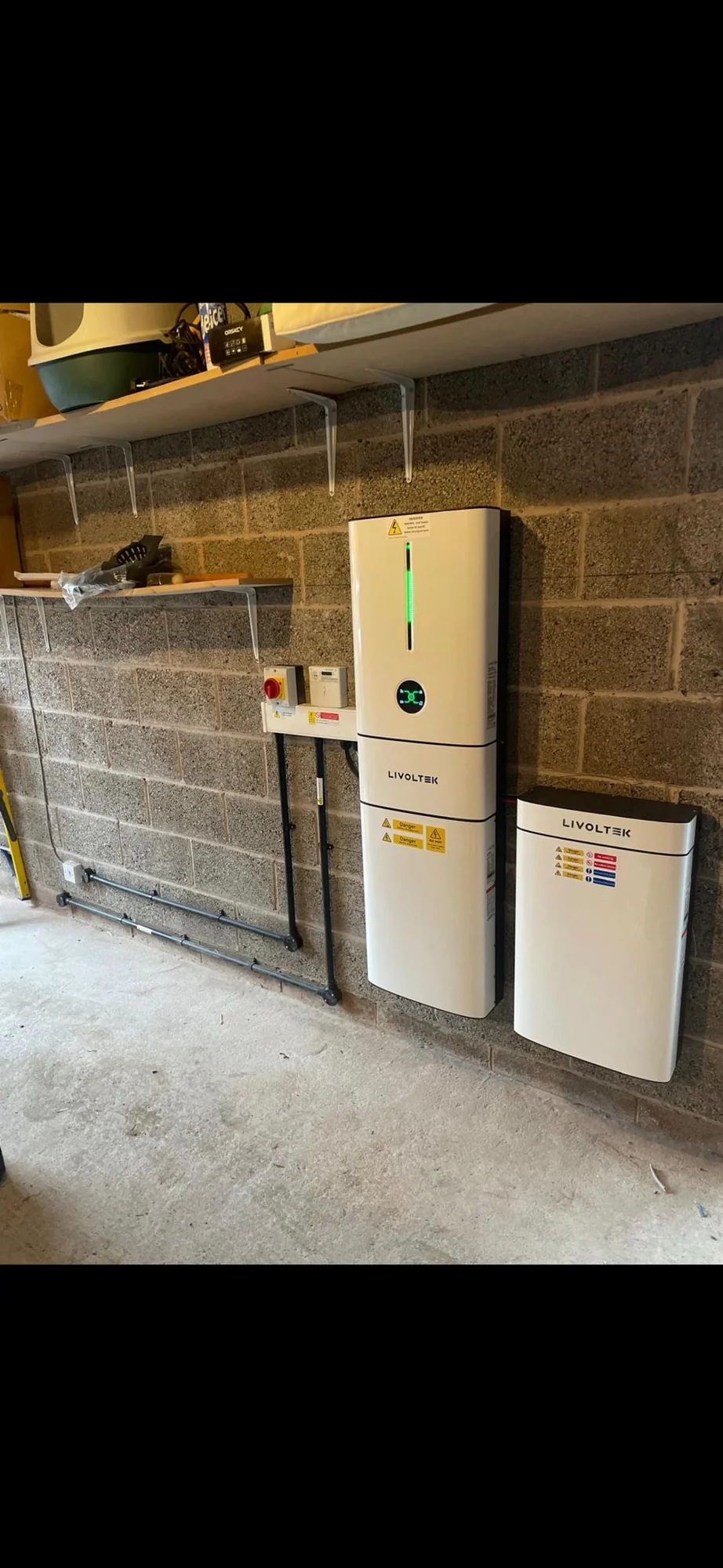 Home battery installed in a timber outbuilding