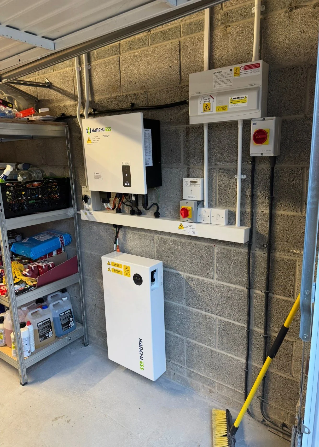 Outdoor Sigenergy battery mounted against a brick wall