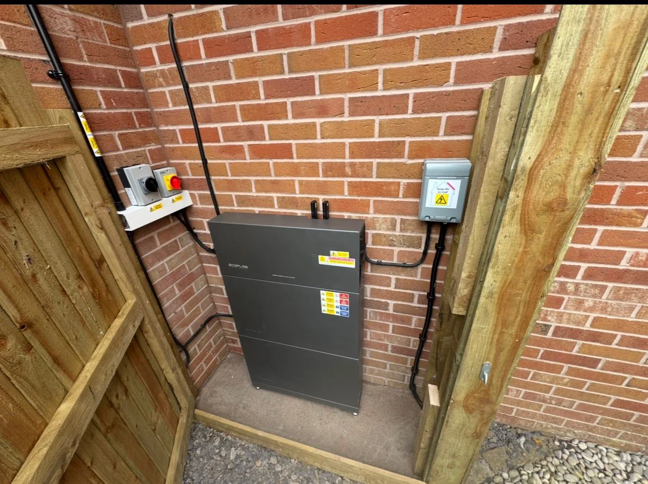 Outdoor home battery in a weatherproof enclosure