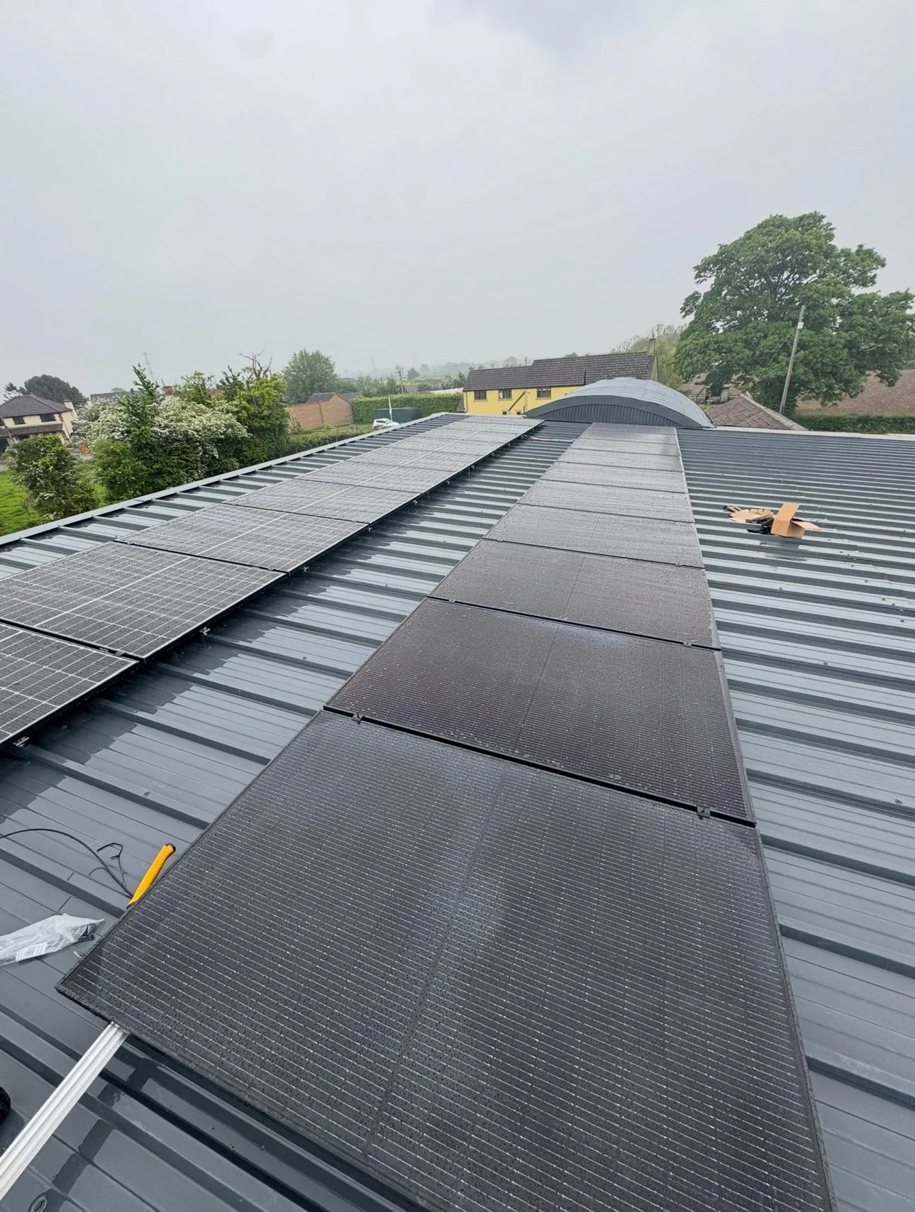 Close view of solar panels on a metal pitched roof