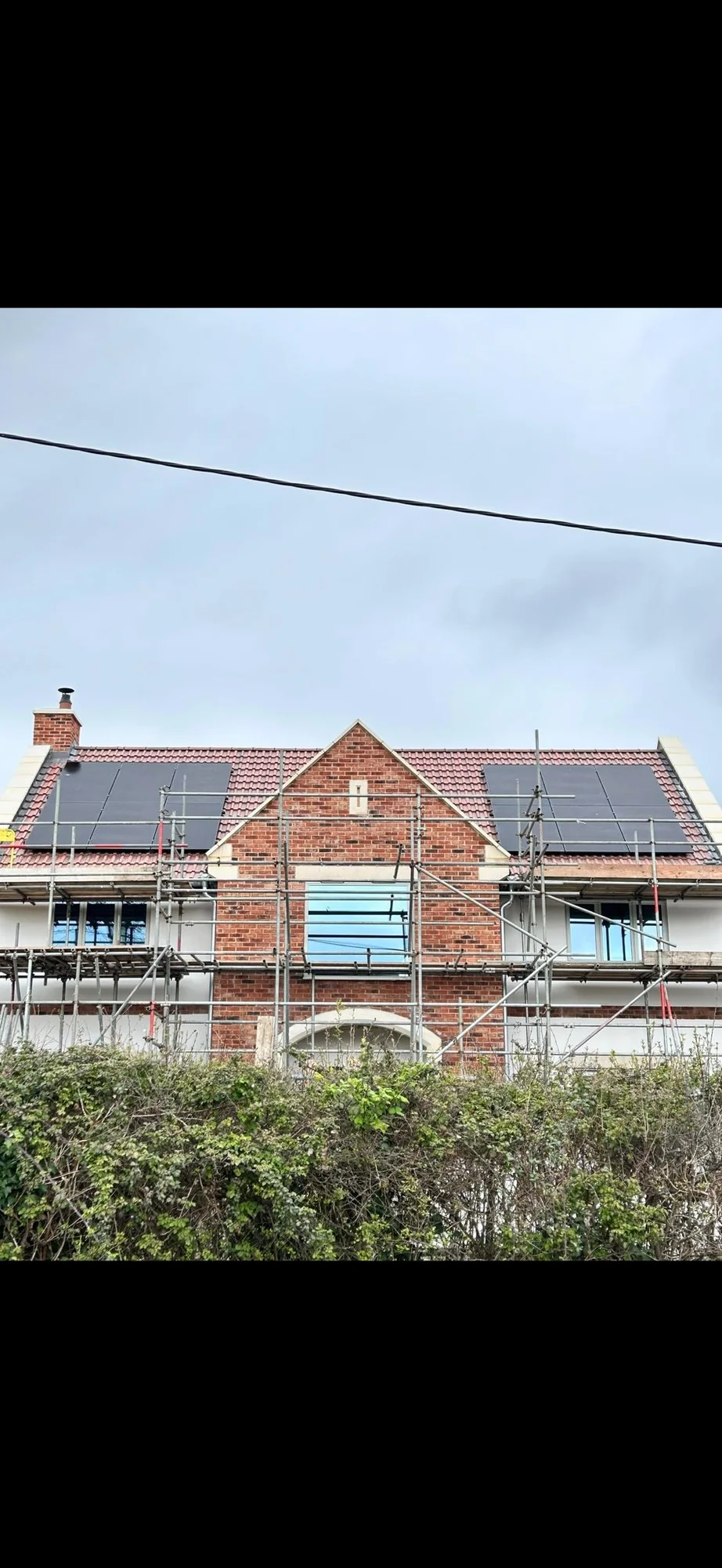 Aerial view of a new-build estate with rooftop solar